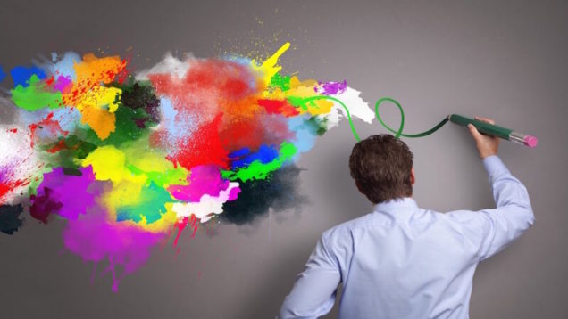 Businessman painting abstract colorful design on gray background concept for  business creativity, i